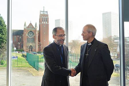 Fr Nicholas and the Archbishop in the Assembly Room with St Alban's Church in the Background